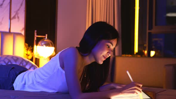 Young Asian beautiful woman enjoy using smartphone