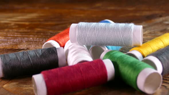 Spools of Colored Thread Close-up. Textile Industry. Sew with a Needle and Thread. Embroider on