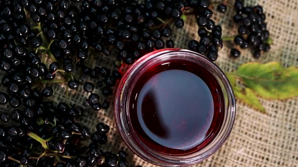 Natural Elderberry Juice. Black Elderberry On A Wooden Background. Herbal Medicine.