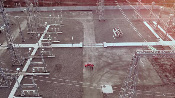 Workers Walk To Check Electrical Substation Aerial View