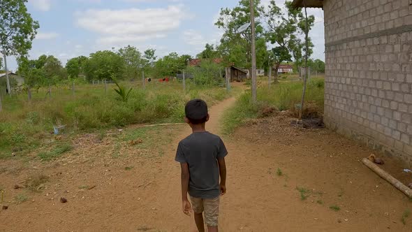South Asian Boy Walk On Rural Village Path