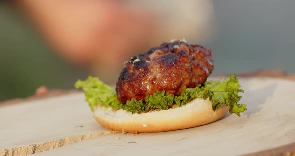 Forming A Burger With A Cutlet Cooked On The Grill