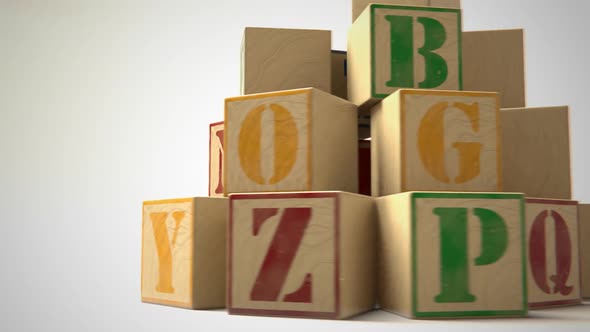 Blocks with colorful letters. Toys used to teach children spelling and writing. alt