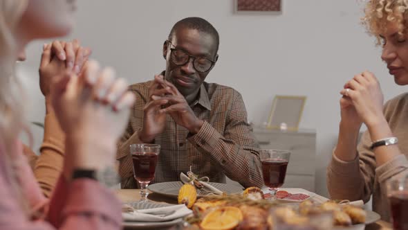 People Praying before Dinner alt