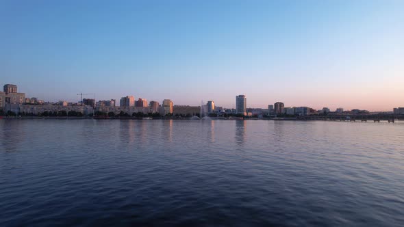 Dnipro city centre and Sicheslavskaya embankment in the rays of the sunset.