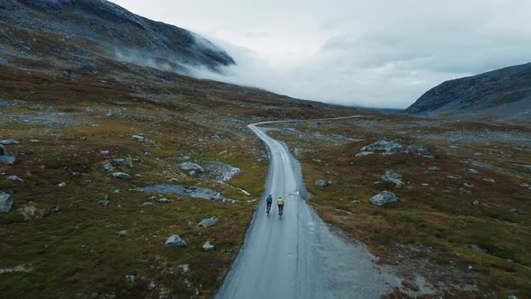 Epic Drone Shot of Young Cyclists Enjoying Ride alt