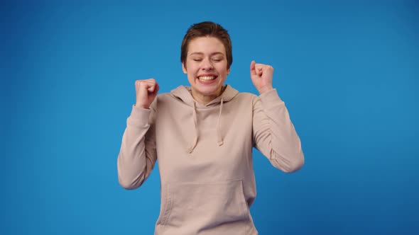 Joyful Young Lady Expressing Happiness Achieving Her Goal