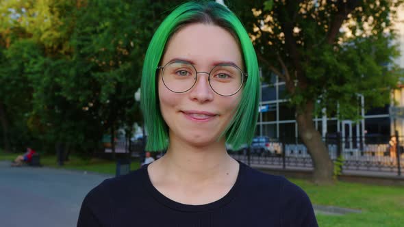 Girl Looking at Camera Smiling Blinking alt