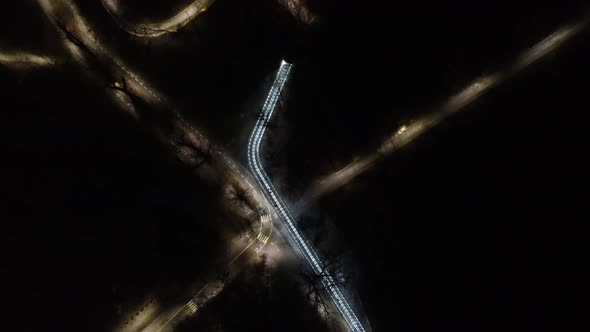 Night alleys elevated bridge in Kharkiv city park alt
