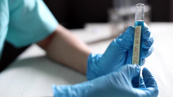 Doctor holding a coronavirus COVID-19 vaccine