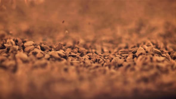 Super Slow Motion Pellets of Instant Coffee Fall Into a Heap alt
