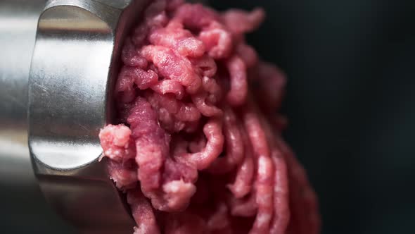 meat grinder with freshly ground meat. Cooking minced pork in an electric meat grinder at home.