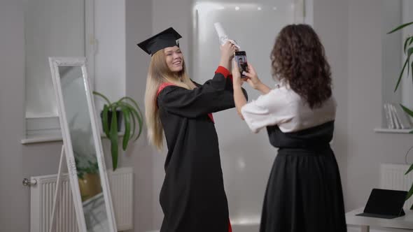 Medium Shot Portrait Happy Woman in Graduate Outfit Posing As Mature Mother Taking Photos on alt