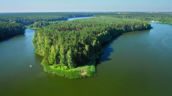 Big island on lake in Poland, aerial view alt