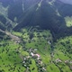 Aerial photography using a drone from a high altitude of a village surrounded by forests and natural - VideoHive Item for Sale