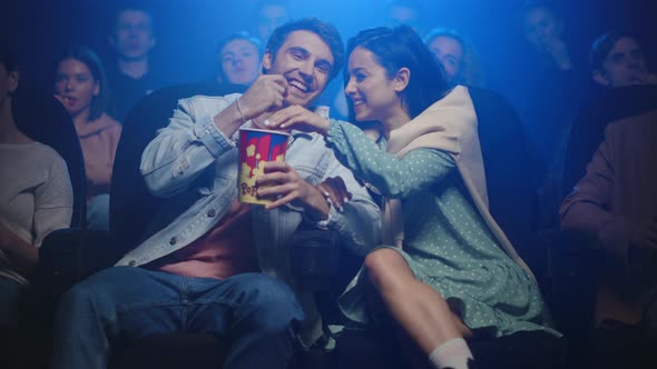 How do you cuddle at a cinema?