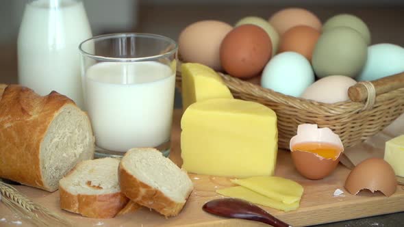Table with Rustic Products Milk Bread Eggs Butter Cheese Olive Oil