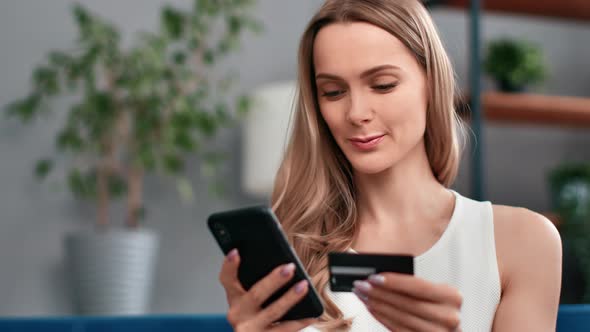Beautiful Young Blonde Woman Paying Card Smartphone Application Enjoy Online Shopping Closeup alt