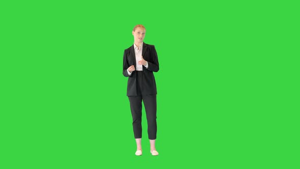 Young Blonde Businesswoman Explaining Something on a Green Screen Chroma Key alt