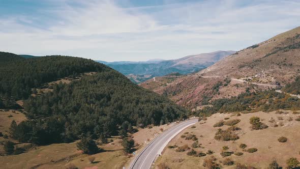 Aerial view of a road that crowns a mountain overlooking the valleys of the Pyrenees