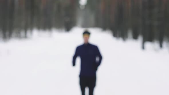 Close Up Portrait of Jogger Looking Determined Into Camera alt