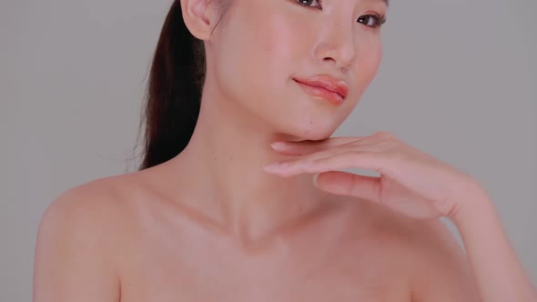 Portrait of Asian young woman with soft make-up and white skin. alt
