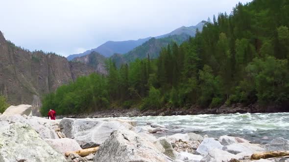 Inspection of obstacles before passing by extreme sportsmen on the Oka Sayanskaya river