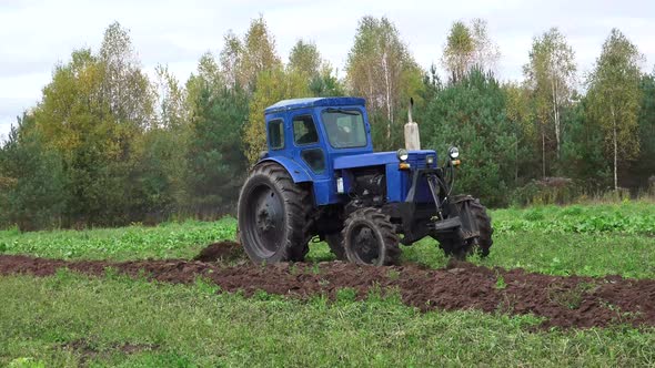 Old Soviet Tractor And Plowing 2