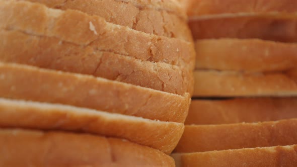 Fresh toasting bread pieces close-up food background slow tilt 4K 2160p 30fps UHD footage - Tilting  alt