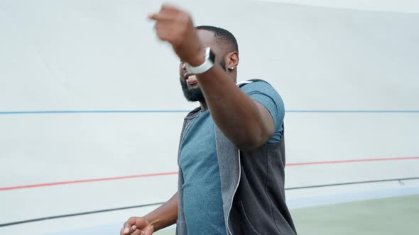 Sportsman Warming Hands on Stadium Track, Sporty Guy Preparing for Workout alt