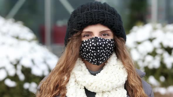 Young Woman in Medical Face Mask Standing Against City COVID-19 Pandemic Coronavirus