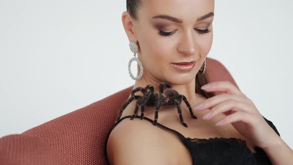 Big Black Spider on a Woman's Chest alt