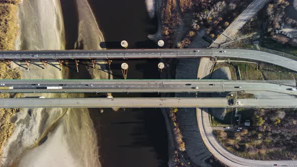 a Large Automobile Bridge Over the River From a Bird'seye View Timelapse alt