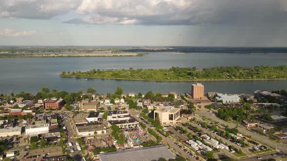 Wyandotte township with rain cloud passing by, aerial timelapse view alt