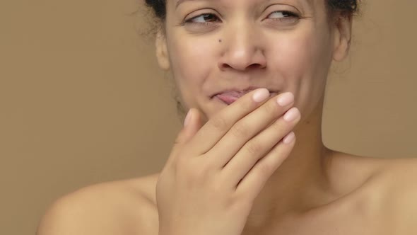Beauty Portrait of Yawning Young African American Woman is Suffering From Neck Pain alt
