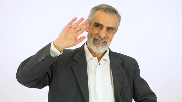 An Elderly Man Smiles and Waves at the Camera - White Screen Studio