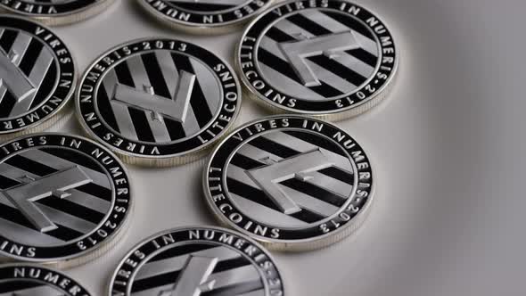 Rotating shot of Litecoin Bitcoins (digital cryptocurrency) - BITCOIN LITECOIN 0094 alt