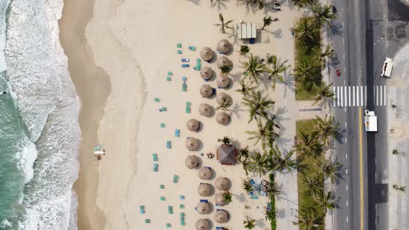 Aerial View of a Wonderful White Sand Beach with Waves Brushing on the Shore Road and Moving alt