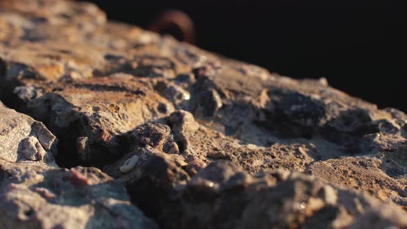 Abstract Dolly Shot of Stone Concrete Slabs on the Beach