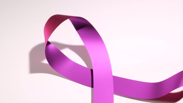 Beautiful shiny pink ribbon symbolizing breast cancer awareness. Moral support. alt