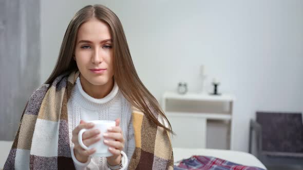 Charming Young Woman Trying Get Warming Up Drinking Hot Beverage From White Mug alt