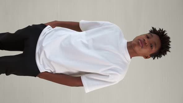 Vertical Video of Young African American Teenager Portrait Middle Shot alt