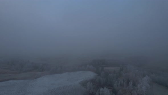 Foggy arial view over Norwegian farm covered in fog. Northern Norway (Scandinavia), Helgeland, Blåfj alt