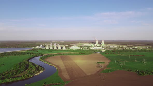 Nuclear power plant cooling towers emissions of steam in the air atmosphere. alt