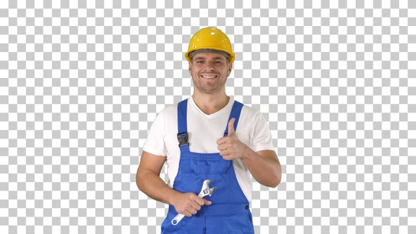 Worker with wrench showing thumb up and smiling to camera alt