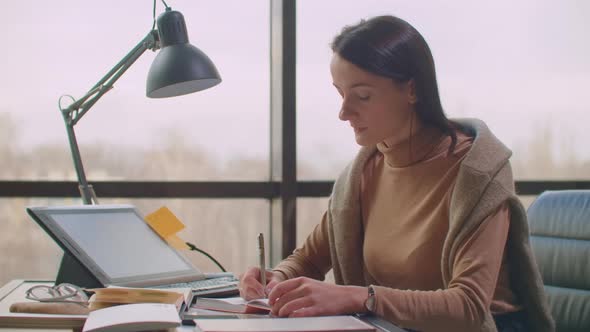 View on Big Sheet of White Paper Canvas with Word Calligraphy Spelled on Top Using Brush with Black alt