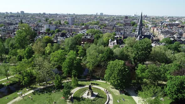 Aerial view of famous park Vondelpark in Amsterdam, Netherlands, Dron view with city panorama