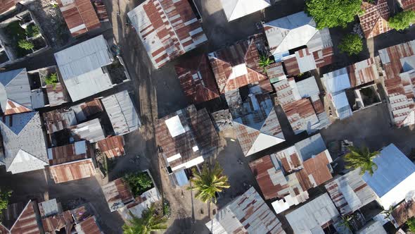 Aerial View of Houses Near the Coast in Zanzibar Tanzania Slow Motion alt