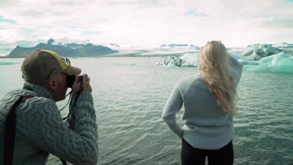 Caucasian Woman Posing In Photographer At Jokulsarlon Glacier In Iceland. - medium shot alt