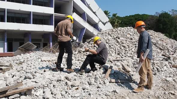 Demolition control supervisor teams and foreman discussing on demolish building.